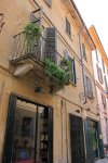 A house with a balcony in the streets of Pavia